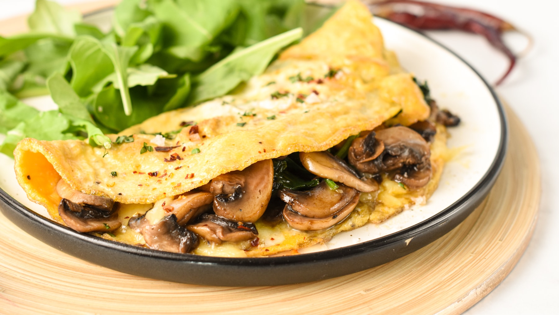 mushroom and onion omelette with tomatoes